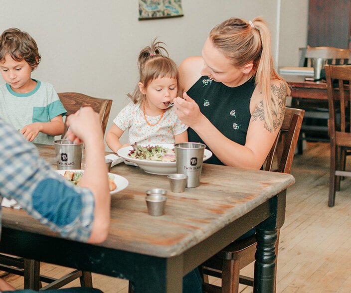 Image: Happy family enjoy cafe food at Twin Beans Coffee Company