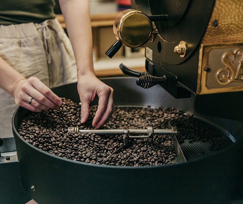 Image: Espresso beans being checked in the coffee roasting cycle